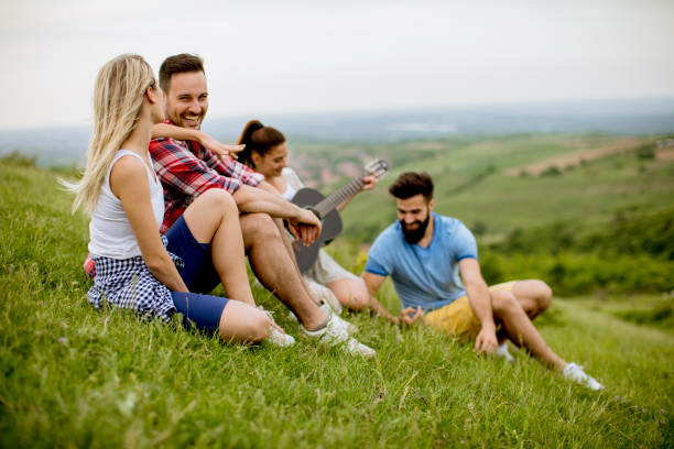 istock Group od young people having fun on a field trip in nature on a mountain 1220755329