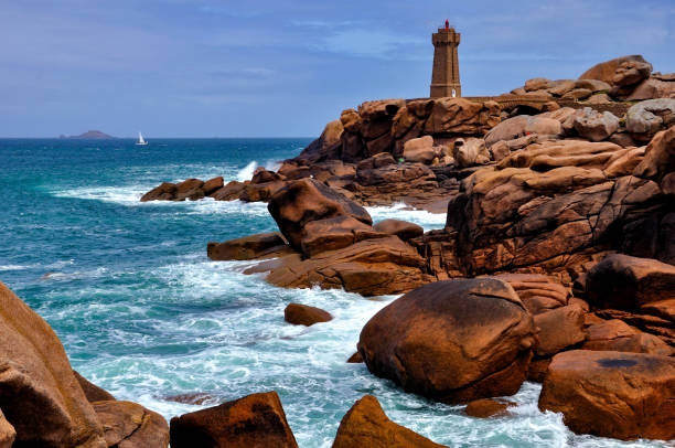 istock Sea, lighthouse and red rock 1220757515