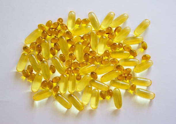 istock Gelatinous capsules with the cod-liver oil-omega3 on white background. Web banner with a copy space. 1220759555