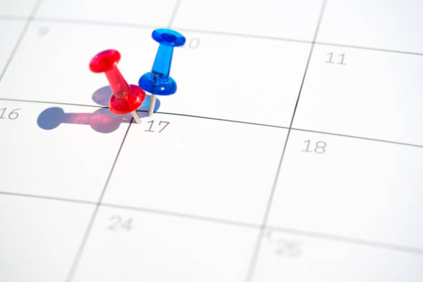 istock Flag colored pushpins on 17th day of the month 1220759983