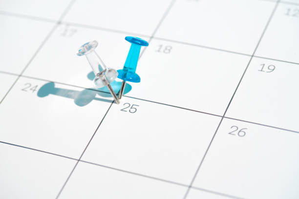 istock Flag colored pushpins on25th day of the month 1220760035