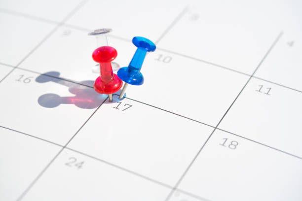 istock Flag colored pushpins on 17th day of the month 1220760036
