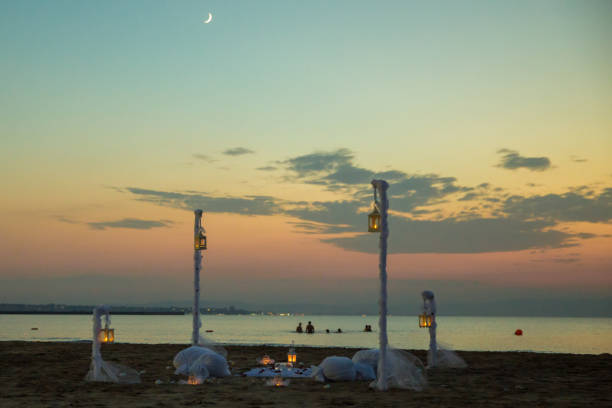 istock Selective focus point on Azerbaijan light lantern decoration sunrise at sea . Square white metallic candle holder lantern . 1220760120