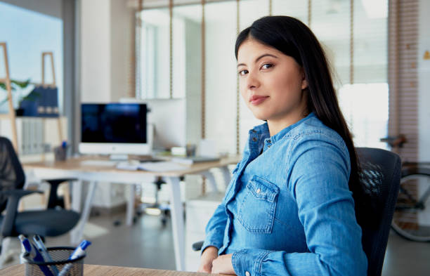 istock Bossy woman behind her desk 1220760511