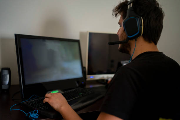 istock Teenager playing games on PC 1220762151
