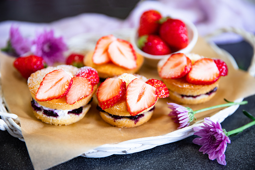 Traditional mini Victoria sponge cakes with whipped cream and strawberries