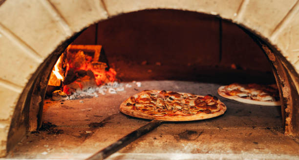 istock Italian pizza is cooked in a wood-fired oven. 1220765892