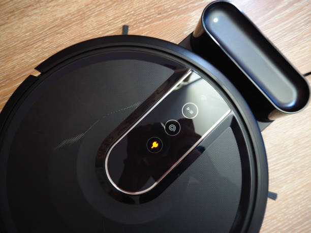 istock Robot vacuum cleaner cleans the apartment 1220766686
