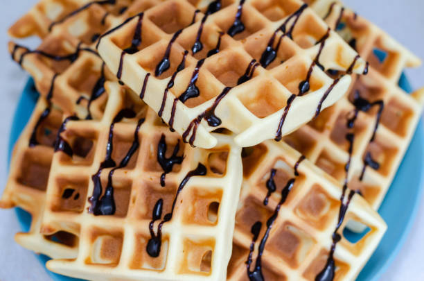 istock Homemade Viennese Waffle with chokolate topping  Maker Waffles.  Stay home 1220768466