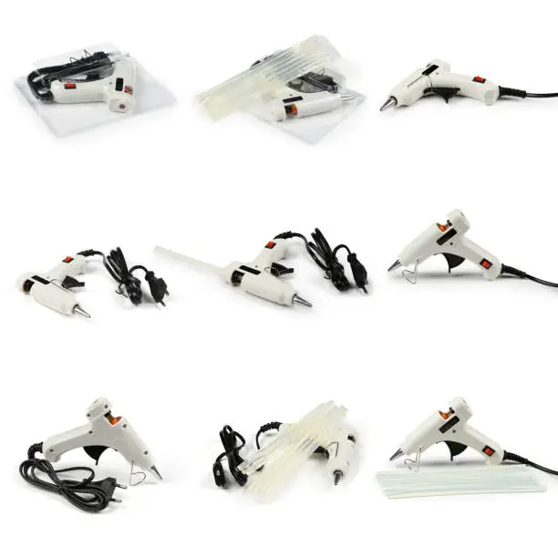 Nine electric hot glue gun isolated on white background. High resolution photo. With clipping path. Full depth of field.