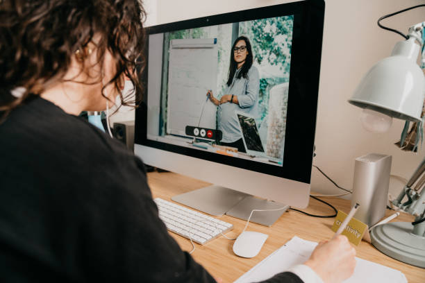 istock Young woman having a video call with her colleagues 1220777889