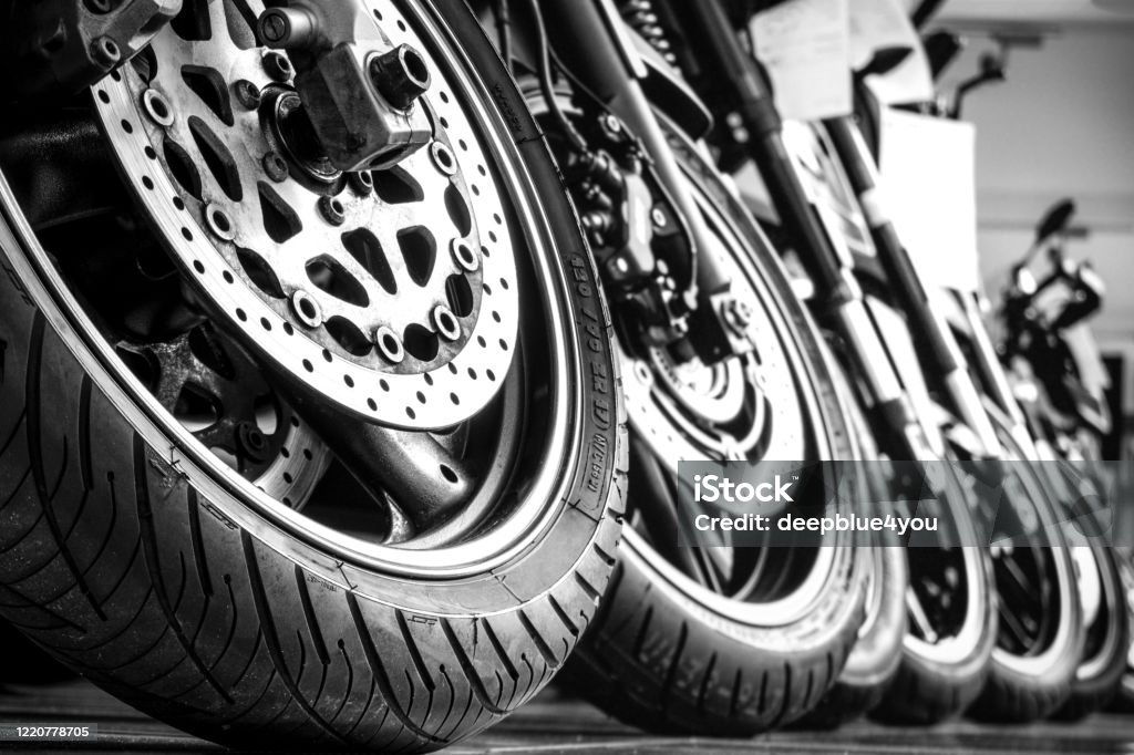 Motorcycles front wheels in a row Motorcycle Stock Photo
