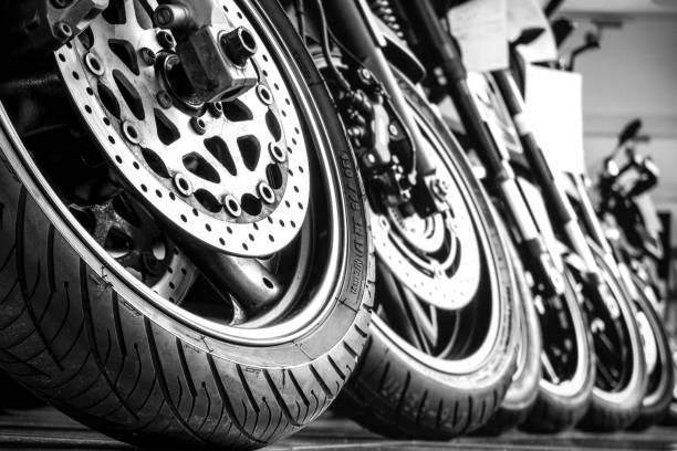 Motorcycles front wheels in a row Motorcycles front wheels in a row brake disc photos stock pictures, royalty-free photos & images