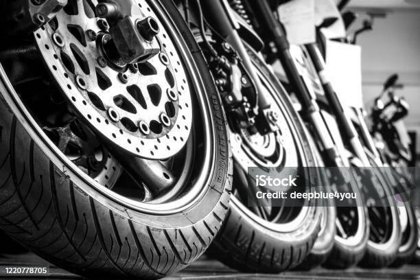 Motorcycles Front Wheels In A Row Stock Photo - Download Image Now - Motorcycle, Tire - Vehicle Part, Buying