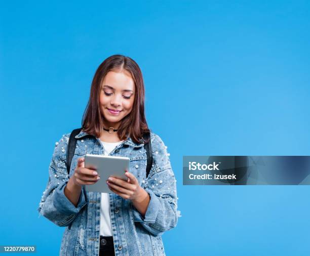 Portrait Of Female High School Student Using Digital Tablet Stock Photo - Download Image Now