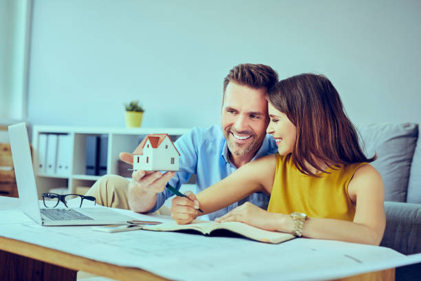 Couple planning new home layout stock photo