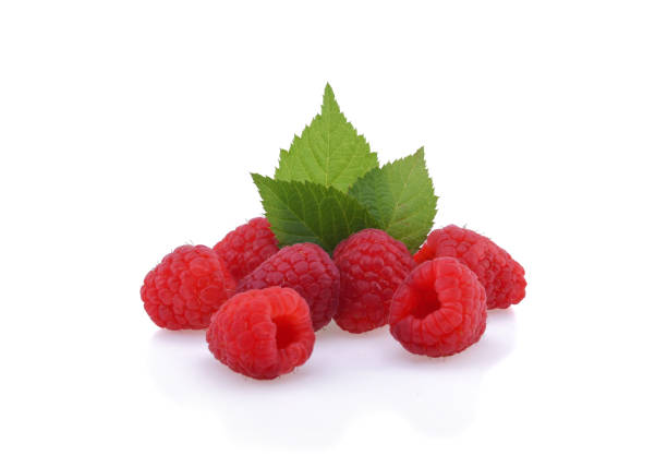 istock ripe raspberries with green leaf isolated on white background 1220781998