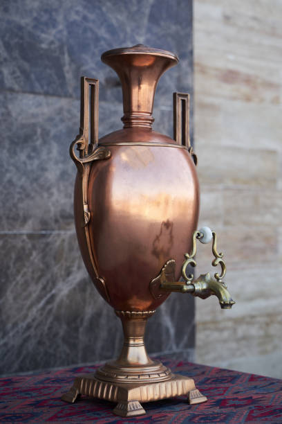 istock Samovar, russian tea pot. Vintage samovar on marble background 1220783716