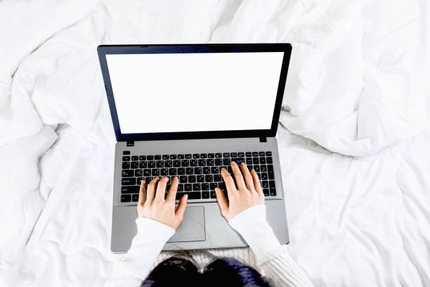 istock selective focus cropped hand typing on keyboard,working with blank screen laptop in bedroom from home 1220783987