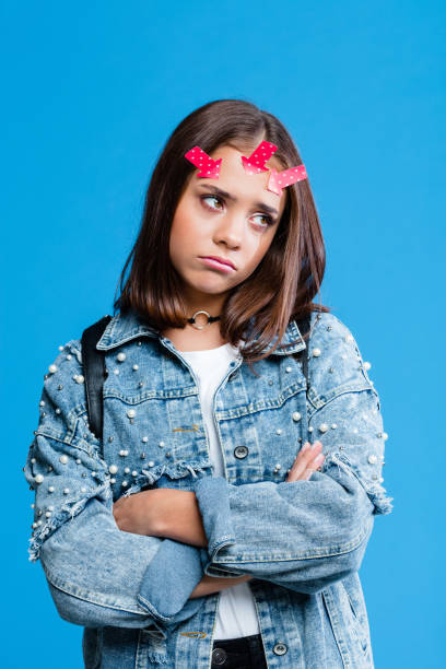 istock Worried female hight school student with adhesive note on forehead 1220785154