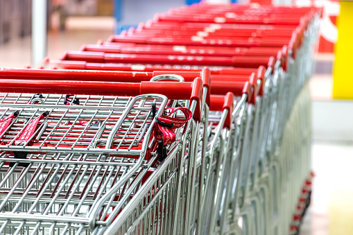 Supermarket cart - trolleys in a row.