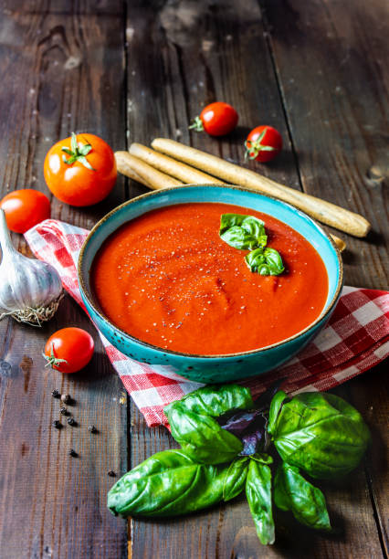 istock tomato soup in a plate wooden background 1220786940