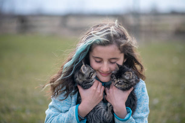 istock Girl and her kitten 1220788194