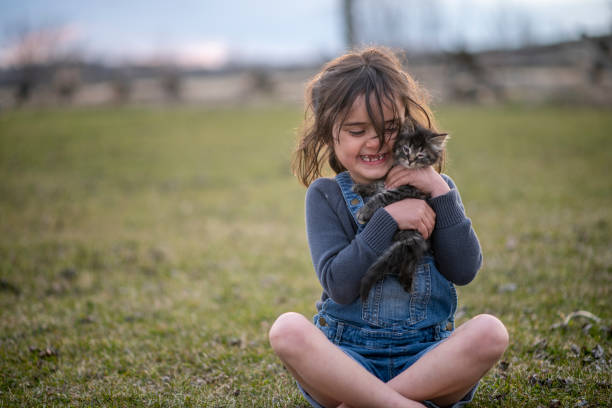 istock Girl and her kitten 1220788218