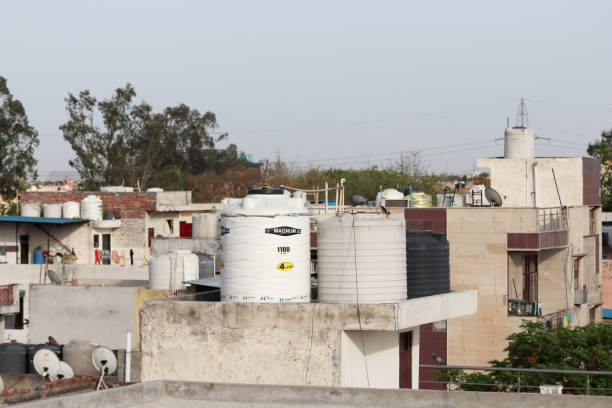 Rohini, New Delhi, India, April 07, 2020 : Water tank and satellite Dish, on residential building.