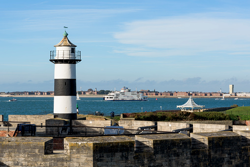 View from Southsea Castle to Gosport and a ferry entering Portsmouth, Hampshire, UK