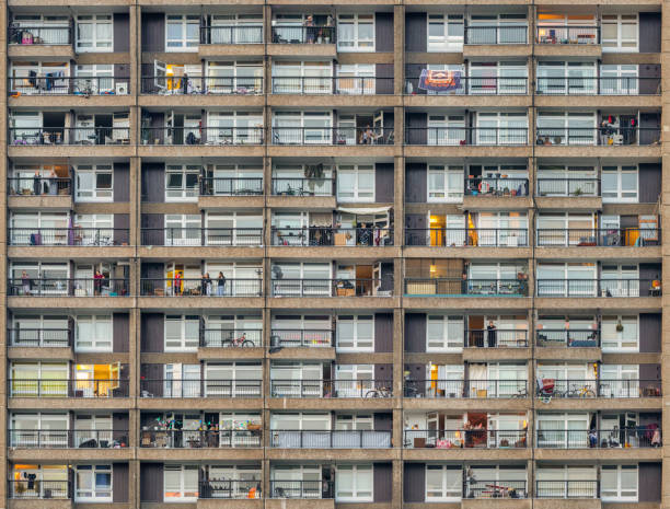 Social distancing during the Covid 19 pandemic during the NHS clap Thursday evening at 8pm The beautiful Brutalist Trellick Tower in London where the residents gather to clap their appreciation to the NHS and British key workers trellick tower stock pictures, royalty-free photos & images
