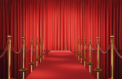 Theater stage with red velvet curtains and event carpet with golden barrier. 3d illustration