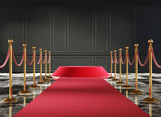 istock Classic luxury interior with black wall and event carpet with golden barrier. 1220792834