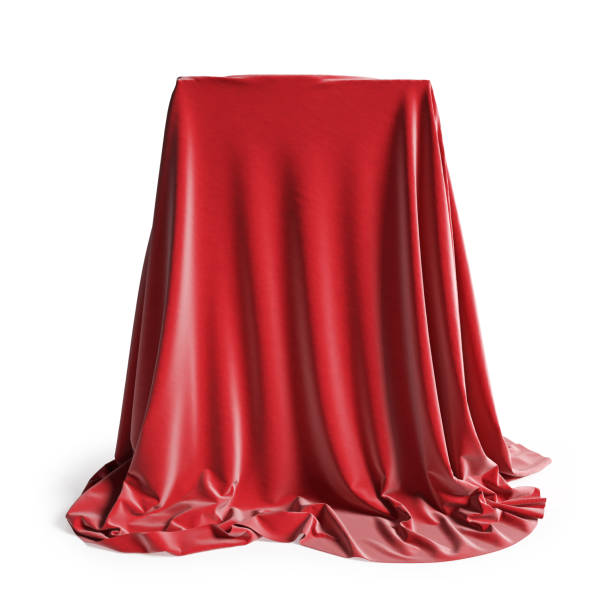 istock Empty podium covered with red silk cloth. Isolated on a white background with clipping path. 1220792908