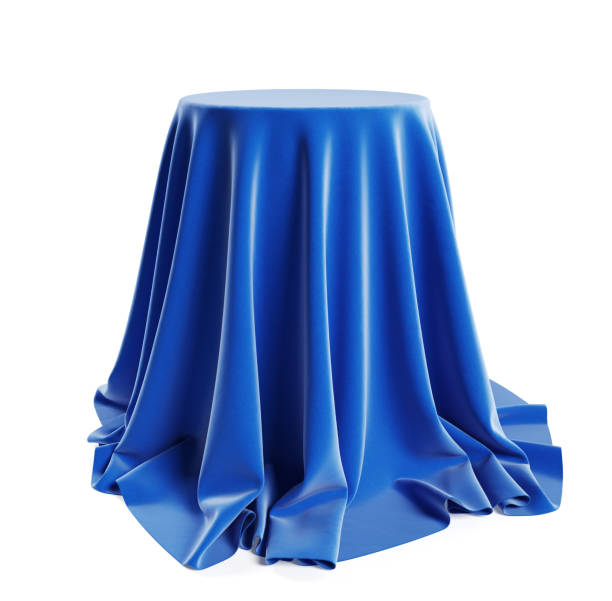istock Round podium covered with blue cloth. Isolated on a white background with clipping path. 1220792940