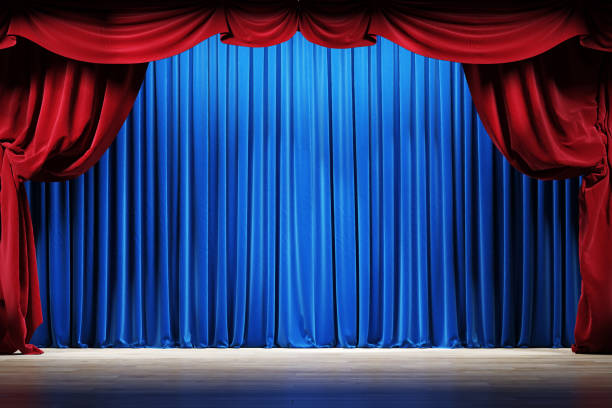 istock Theater stage with red and blue velvet curtains. 1220793340