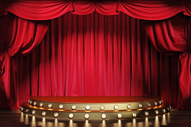 Empty theater stage with red velvet curtains