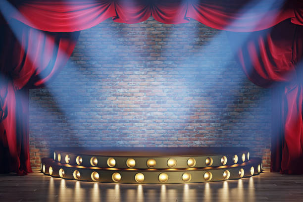istock Theater stage with red velvet curtains, volume light and smoke. 1220794402
