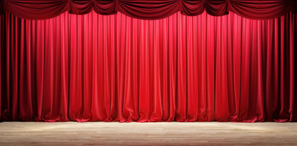 istock Empty theater stage with red velvet curtains. 1220794484