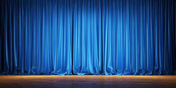 istock Empty theater stage with blue velvet curtains. 1220794834