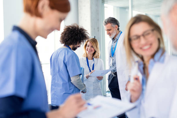 istock Group of doctors on conference, medical team discussing issues. 1220794876