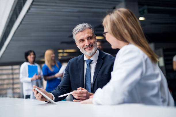 istock Doctor talking to a pharmaceutical sales representative. 1220794892