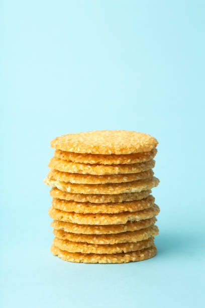 istock Sesame cookies on a blue background. Baking and sweets background. Home kitchen concept 1220795946