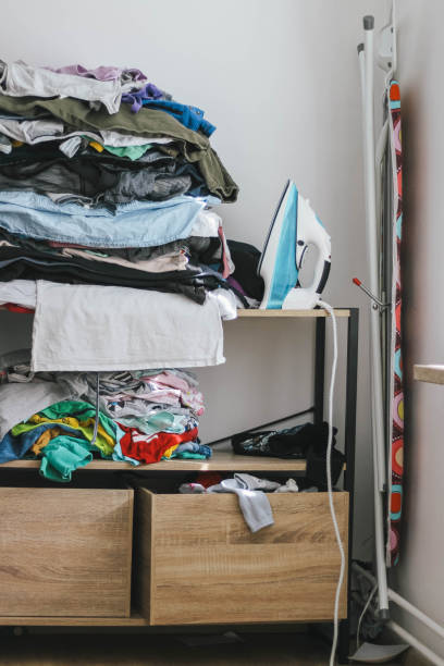 istock Pile of clothes and iron 1220797246