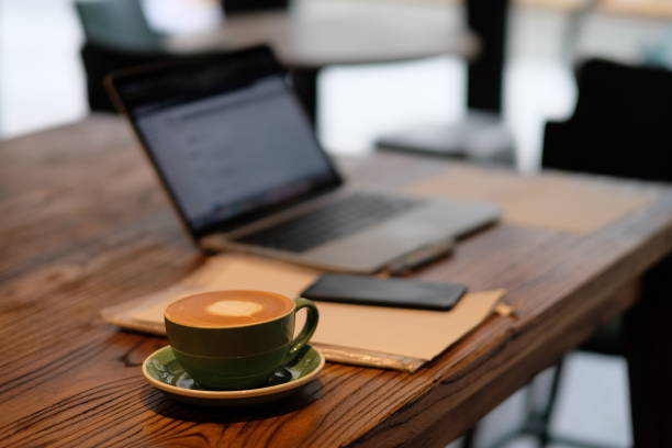istock one cup of coffee and blurred laptop computer on wooden table, working in cafe concept. 1220797300