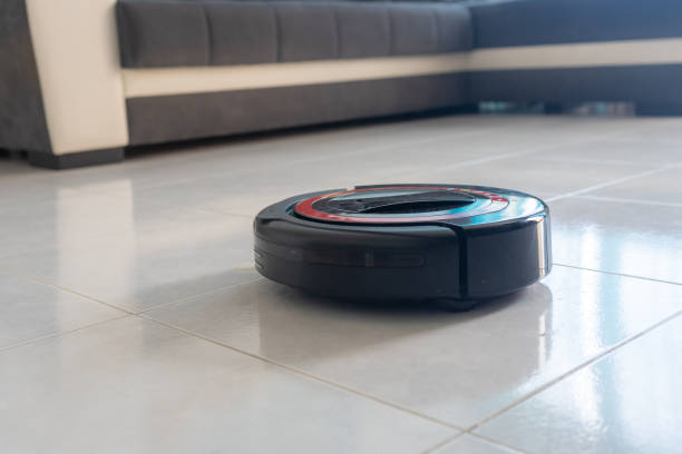 istock Robot vacuum cleaner automatically cleaning the floor. 1220797301