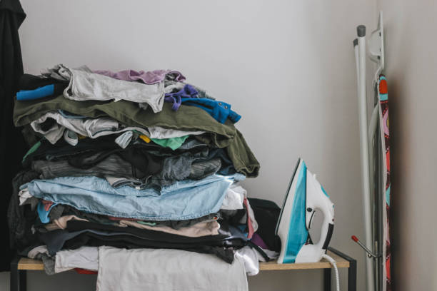 istock Pile of clothes and iron 1220797314