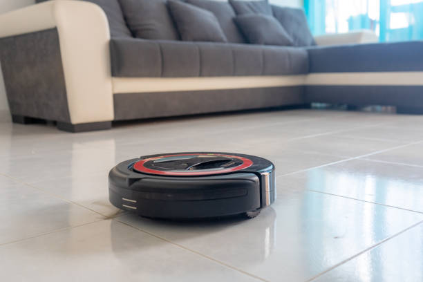 istock Robot vacuum cleaner automatically cleaning the floor. 1220797320