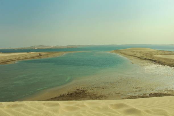 istock A sea side view of blue sky and yellow sand 1220799029