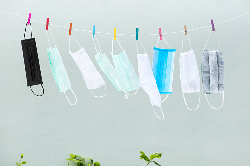 surgical mask on washing line for spread protection anti bacteria and Corona virus Disease (COVID-19).